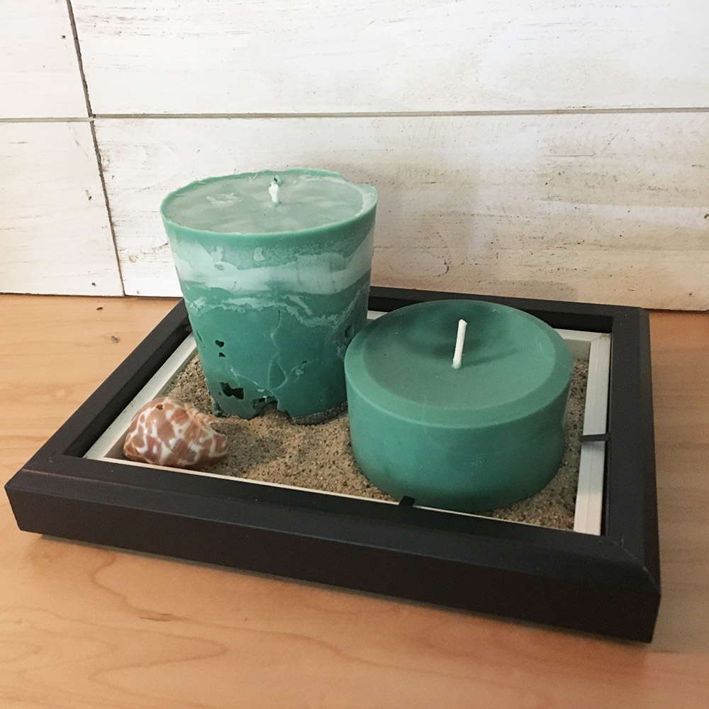 Two pillar candles in 5x7 tray with sand and shells